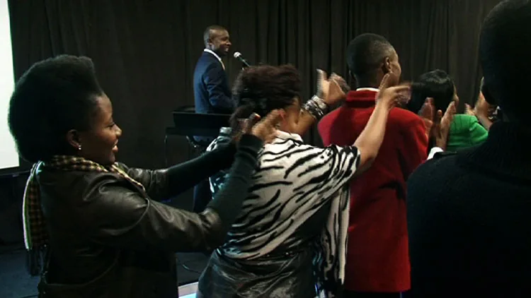 Delegates taking part in an interactive team building exercise