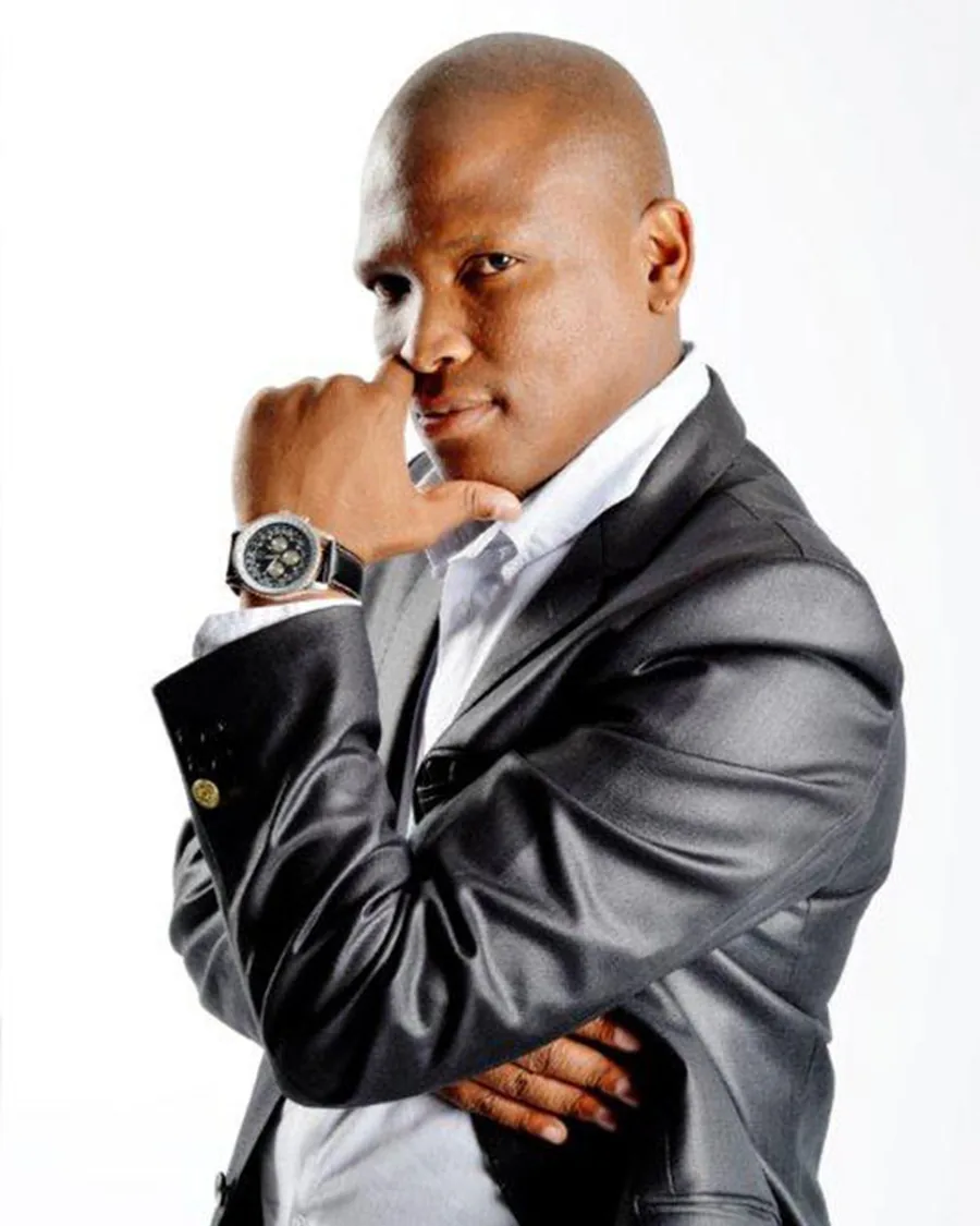 Speaker portrait in a black leather jacket, MC and programme director